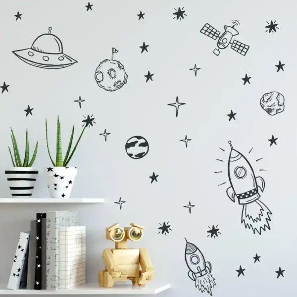 Space-themed wall decor featuring hand-drawn planets, rockets, and stars with potted plants and a wooden robot toy on a white shelf.