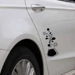 Atom and molecule science decal on car door, black and white design.