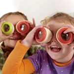 Children playing with colorful science magnifying glasses, exploring and learning through fun educational toys.