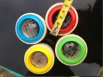 Colorful magnetic levitating globes with transparent spheres and vibrant rings, measuring approximately 2 inches in diameter.