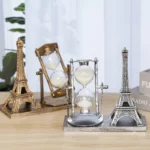Decorative Eiffel Tower and hourglass set for science-themed decor and educational display, featuring metallic finishes and intricate details.