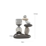 Hourglass with stacked stones and glass ball, modern desk decor, educational science toy, black, white, and gray stones, 19cm wide, 22.5cm tall, 9.5cm deep.