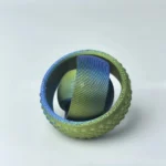 A vibrant fidget spinner featuring a multicolored, textured surface and a central ball bearing, designed for stress relief and focus enhancement.