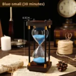 Elegant hourglass timer with blue sand, measuring 19cm in height and 8.5cm in width, perfect for educational demonstrations and decor.