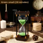 Small green hourglass timer with a 30-minute sand duration, featuring a wooden frame and black metal supports, ideal for science experiments and educational demonstrations.