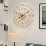 Stylish geometric wall clock with a gold wireframe design, perfect for contemporary home interiors.