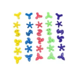 Colorful plastic fidget spinners and puzzle pieces for kids and educational activities.