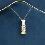 Elegant miniature hourglass pendant necklace featuring a gold chain and detailed glass design, perfect for science-inspired jewelry enthusiasts.