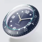 A modern quartz wall clock with a black bezel, white face, and clear numerals, perfect for science-themed decor or educational settings.