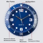 A blue analog clock with labeled features including abs frame, HD numbers, aluminum sleeve reinforced pointer, silent movement, highly transparent glass.