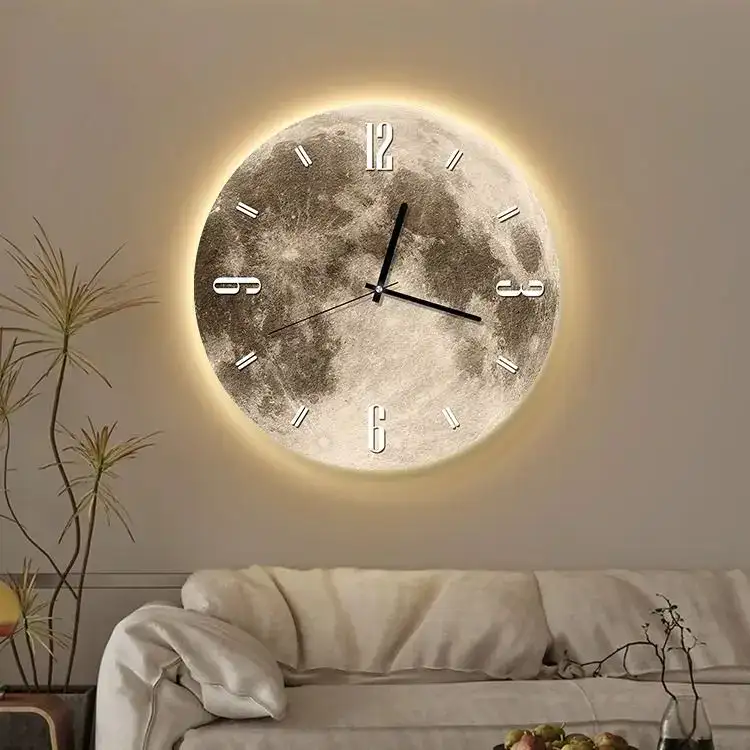 Moon Phase Wall Clock with Backlit Design Modern moon phase wall clock with backlit illumination, perfect for home decor and educational spaces. Features a realistic lunar surface design and easy-to-read numbers.