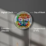 Bright digital clock showing time, day of the week, calendar date, and temperature in Celsius and Fahrenheit, featuring a vibrant, artistic splash design.