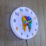 Colorful abstract wall clock with vibrant splashes of paint and bold numbers, perfect for science-themed decor and educational spaces.