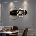 Stylish wall clock featuring a contemporary black and gold design with abstract white accents, perfect for modern interior decor.