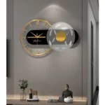 Stylish modern wall clock featuring a globe and mannequin decor, perfect for contemporary interior design.