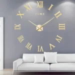 Large wall clock with Roman numerals and "TIME" text on a gray wall, above a white sofa with cushions, in a contemporary living room setting.