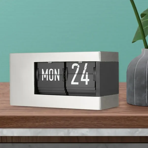 Flip calendar desk clock showing Monday, 24th.