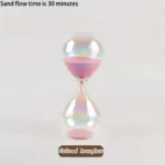 Sand flow hourglass with pink sand, demonstrating a 30-minute timer for science and educational purposes.
