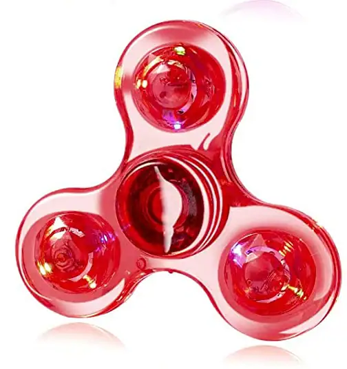 A red transparent fidget spinner with three lobes and a central bearing, designed for stress relief and focus. Made of durable plastic, it spins smoothly and is popular among children and adults.