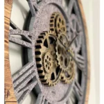 Industrial-style wall clock featuring visible gears and Roman numerals, perfect for modern or steampunk-inspired interior decor.