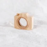 Eco-friendly wooden camera toy for children, perfect for educational play and home decor. Handcrafted from natural wood, it offers a charming, sustainable design.