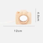Wooden camera toy for children, measuring 12cm by 4.8cm, designed for educational play and science-themed decor.