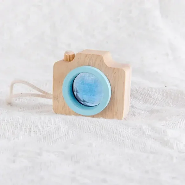 Wooden camera toy with blue lens, perfect for children's educational play and imaginative learning. Crafted from natural wood, it offers a safe and eco-friendly experience.