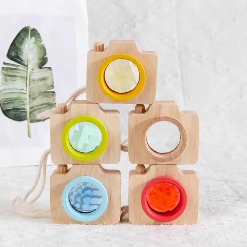 Colorful Wooden Camera Toy for Kids Wooden camera toy with colorful dials and lenses, perfect for educational play and developing fine motor skills in children.