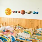 Educational solar system wall decor featuring planets and the sun, ideal for classrooms and children's rooms to promote space learning.