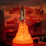 Detailed model of a space shuttle launching with a lava-like flame effect, set against a dramatic sunset sky background. Perfect for science decor and educational displays.
