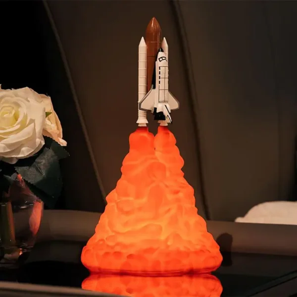 Detailed model of a space shuttle launching with orange flame effect, perfect for science decor and educational displays.