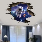 A vibrant space-themed wall decal featuring an astronaut floating in a galaxy with planets and stars, creating an immersive cosmic scene on your ceiling.