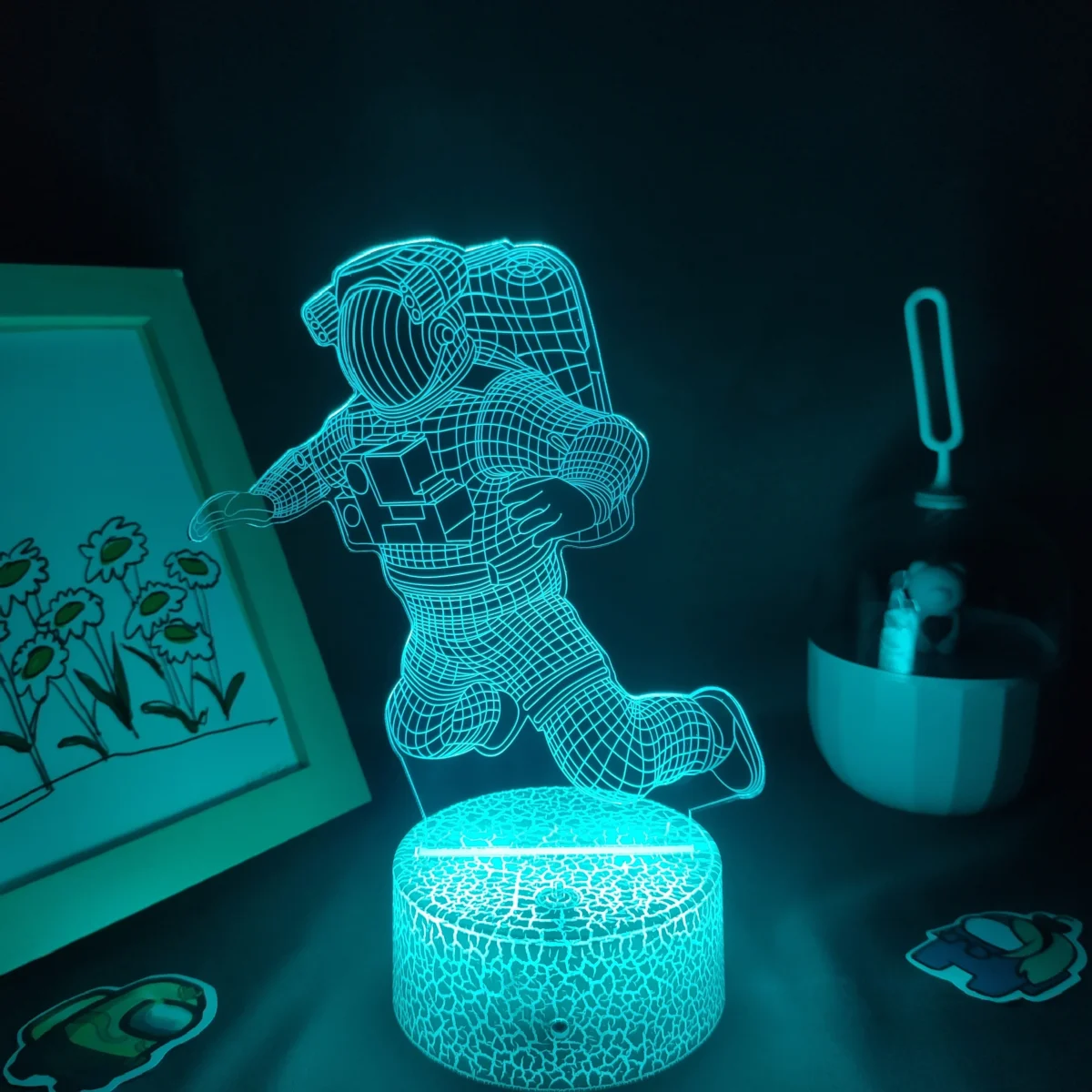 LED 3D astronaut night light with holographic design for kids and adults.