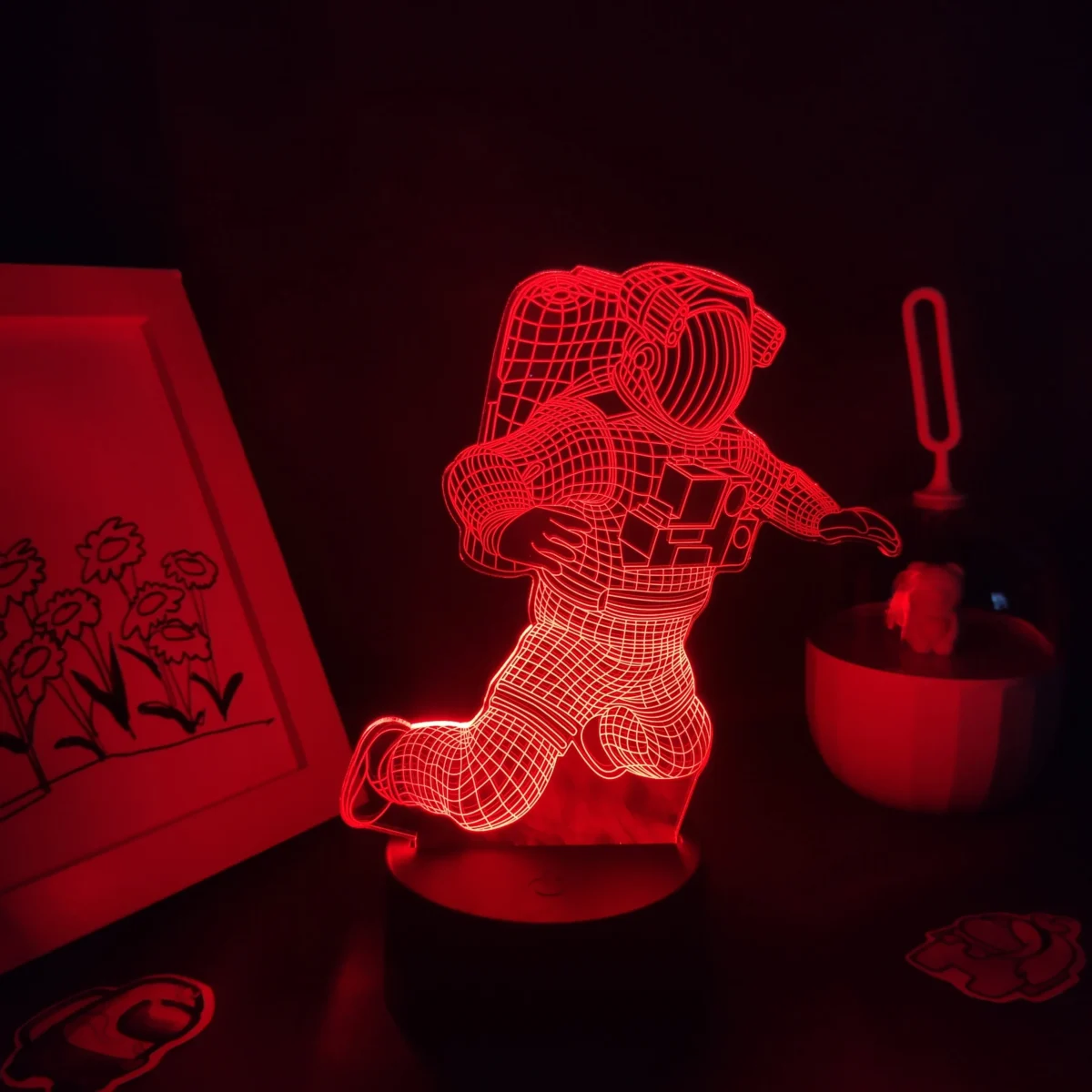 LED astronaut wireframe night light with red glow, perfect for space-themed decor or educational settings.