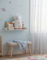 Astronaut Plush Toy with Books and Rocket Model in Child’s Room.
