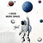 Illustration of an astronaut holding a large blue planet balloon with surrounding planets and stars, featuring the text "I NEED MORE SPACE" in a playful space theme.