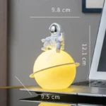 Astronaut Lamp Sitting on a Planet Lamp with Dimensions.