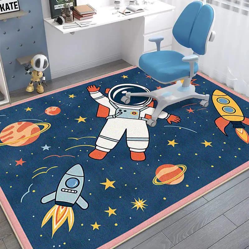 Space-themed Kids Rug with Astronaut and Rocket Design Brightly colored space-themed children's rug featuring an astronaut, rockets, planets, and stars, perfect for a child's bedroom or playroom.