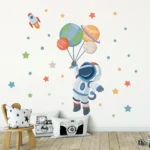 Adorable astronaut wall decal with planets and stars, perfect for children's rooms and educational spaces.