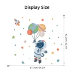 Whimsical space-themed wall decal featuring a cartoon astronaut holding balloons shaped like planets, surrounded by stars and a rocket, perfect for children's rooms or educational spaces.