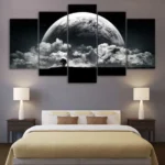 Large moon and cloud wall art above a bed, creating a celestial bedroom decor with a night sky theme.