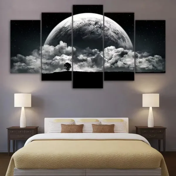 Large moon and cloud wall art above a bed, creating a celestial bedroom decor with a night sky theme.