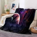 Soft throw blanket featuring a vibrant galaxy and space design, perfect for adding a cosmic touch to your living room or bedroom decor.