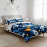 Bright, playful rocket and star print bedding on a cozy bed in a minimalist bedroom.