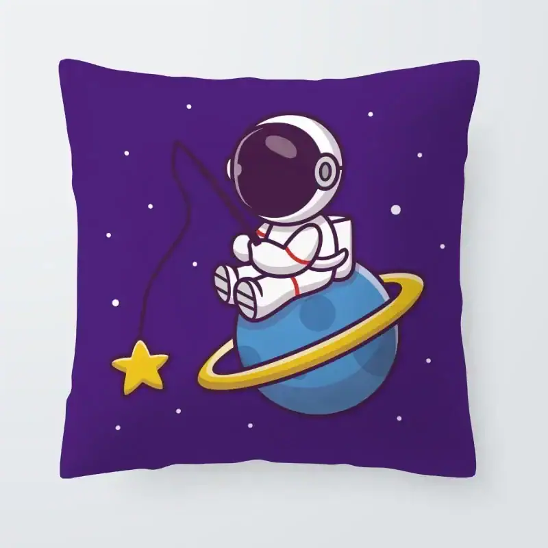 Space-themed astronaut pillow with a cute design. Astronaut sitting on a planet with a ring, surrounded by stars, on a purple background pillow.
