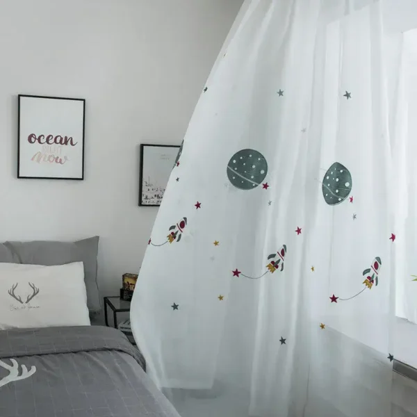 Whimsical space-themed nursery curtain with planets and rockets for kids' room decoration.