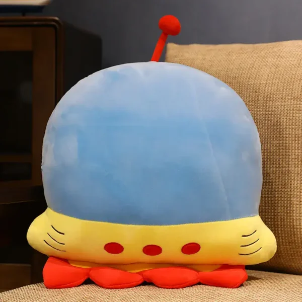 Adorable plush spaceship toy with a blue dome, yellow body, and red details, perfect for kids' rooms or as a science-themed decor piece.
