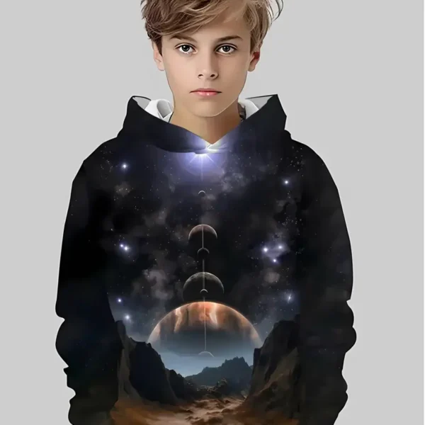 A young boy wearing a hoodie with a cosmic space design featuring planets, stars, and a galaxy scene.