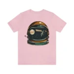 Pink T-shirt featuring a space-themed astronaut helmet with planets and stars inside the visor, perfect for science and space enthusiasts.