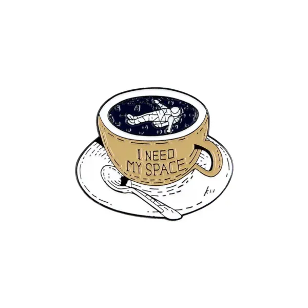 Coffee mug filled with a galaxy-themed beverage featuring an astronaut illustration and the text "I Need My Space" on the mug.